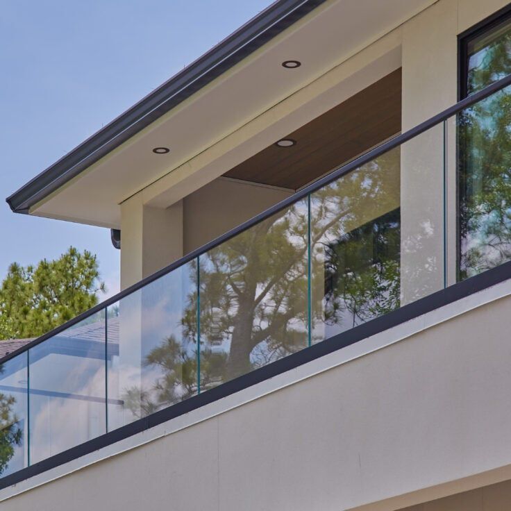 Minimal glass balcony railing system